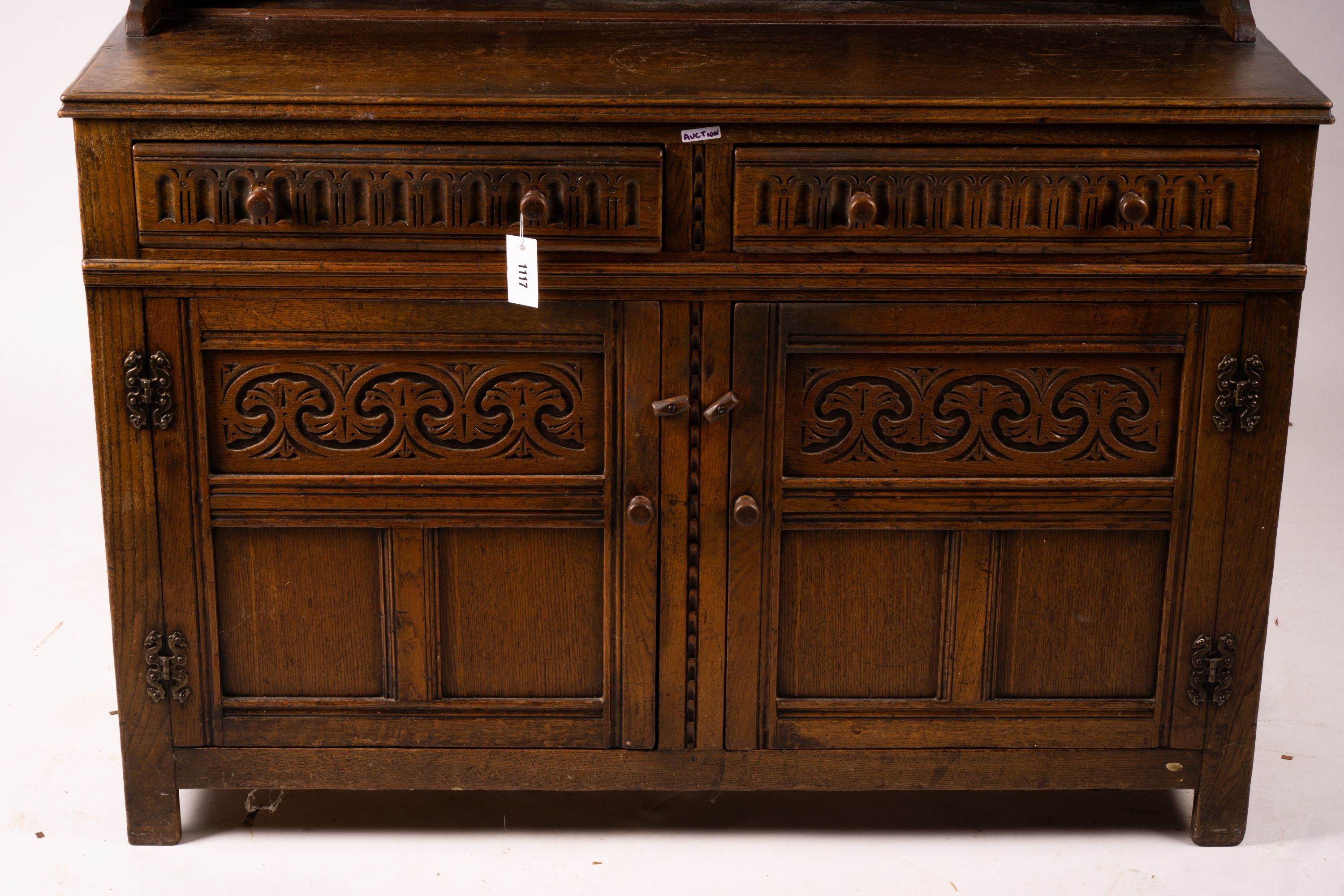 An 18th century style carved oak dresser, width 124cm, depth 46cm, height 175cm